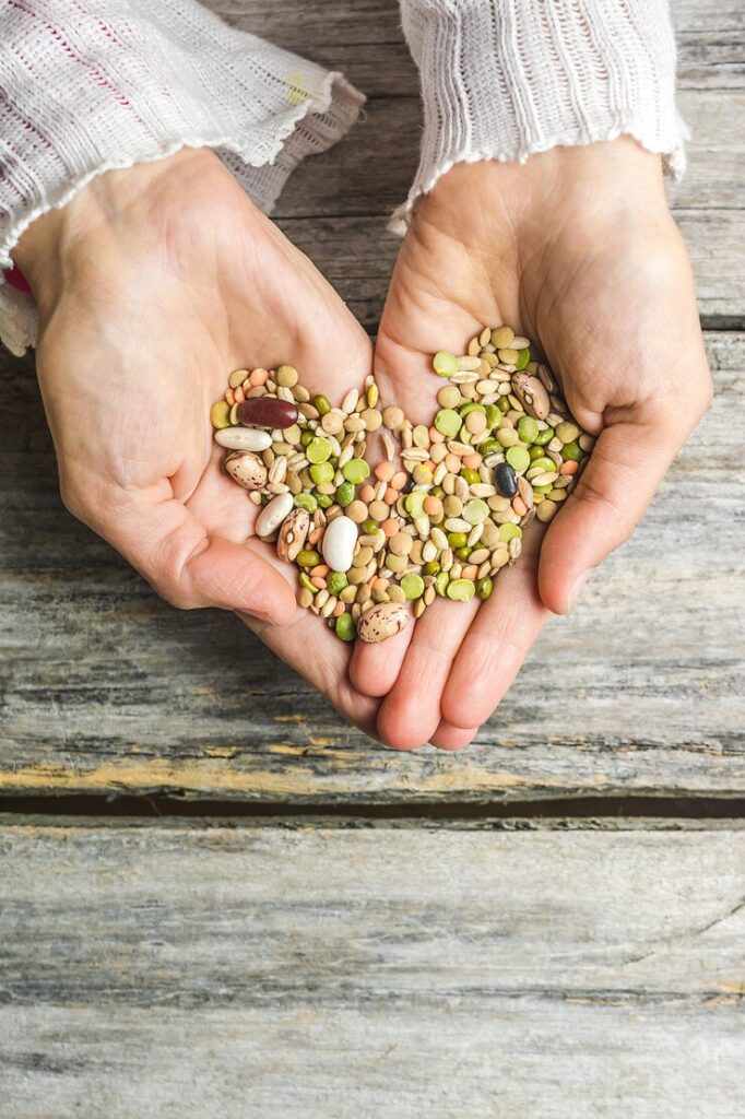 vertical closeup shot female hands holding mixed beans 181624 28689